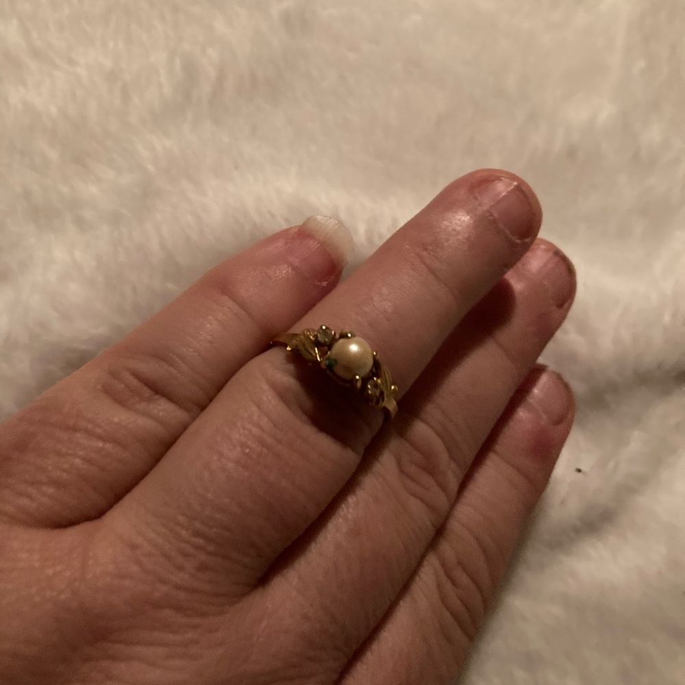 Gold band with faux pearl . Size 9